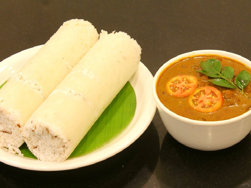 This image has an empty alt attribute; its file name is Puttu_with_Kadala_Curry_Main.jpg